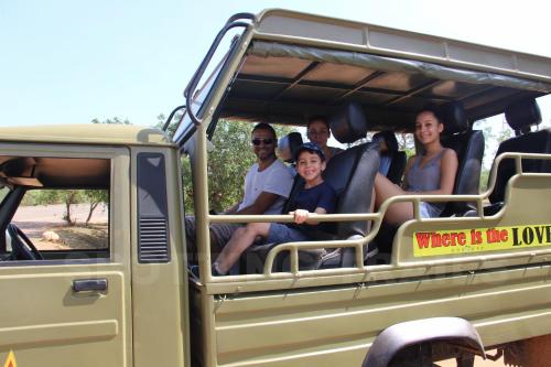 a group of people sitting in the back of a truck at LakeSide Cabana Tissamaharama in Tissamaharama