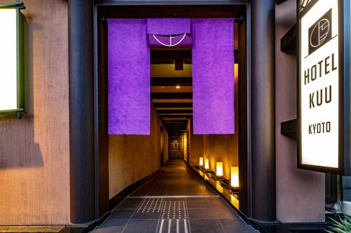 a hallway of a building with purple walls at Hotel Kuu Kyoto in Kyoto