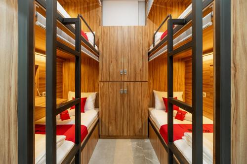 a bunk room with four bunk beds in it at RedDoorz Plus near Senayan City in Jakarta