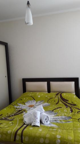 a bedroom with a bed with towels on it at Apartament in the centre batumi in Batumi