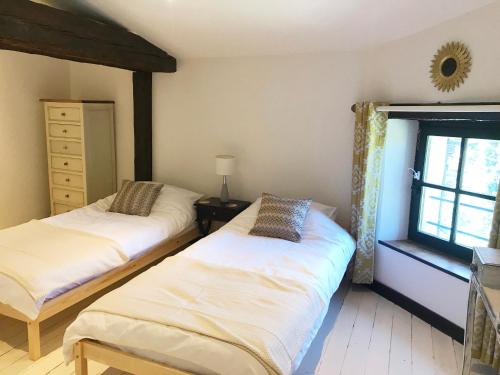Postel nebo postele na pokoji v ubytování Hameau de Montcabirol