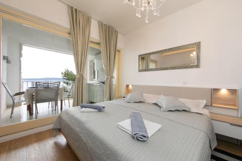 Posteľ alebo postele v izbe v ubytovaní Punta Rata apartment