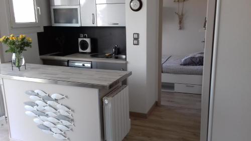 Photo de la galerie de l'établissement Bernières-sur-Mer Appartement chaleureux, à Bernières-sur-Mer