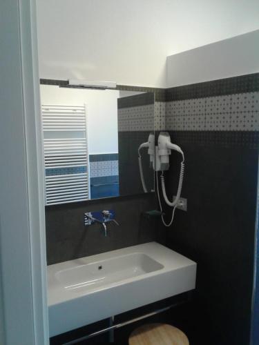 a bathroom with a sink and a mirror at Belo Horizonte in Civitanova Marche