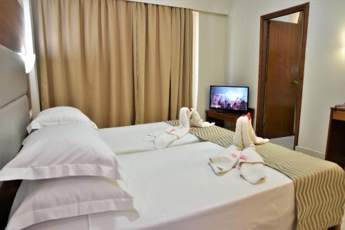Ένα ή περισσότερα κρεβάτια σε δωμάτιο στο Marathon Hotel - All Inclusive
