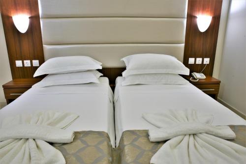 Ένα ή περισσότερα κρεβάτια σε δωμάτιο στο Marathon Hotel - All Inclusive