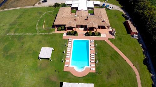 an overhead view of a home with a swimming pool on a lawn at Villa Barbarina - Nature Resort with Pool & Restaurant - Alghero in Santa Maria la Palma