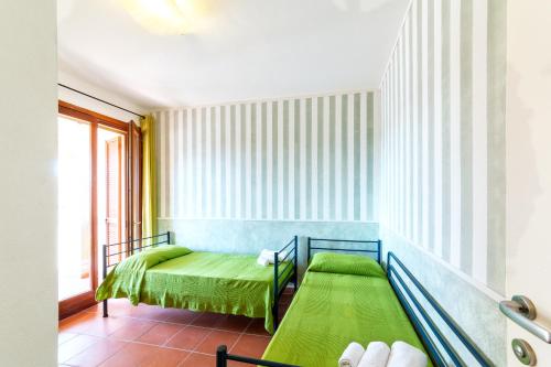 מיטה או מיטות בחדר ב-Residence Ataras
