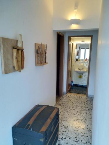 a bathroom with a room with a tub and a sink at Casa Lago Azzurro Apartement in Cannobio