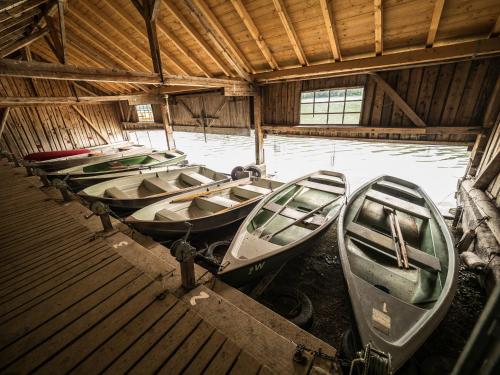 a group of boats parked in a building at Seehotel Weissensee in Füssen