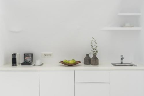 a kitchen counter with a bowl of fruit on it at Aspaki by Art Maisons in Oia