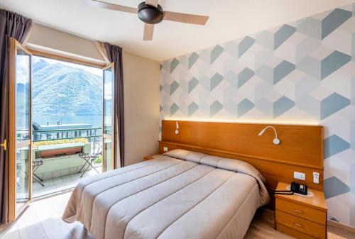 Posteľ alebo postele v izbe v ubytovaní Hotel Argegno