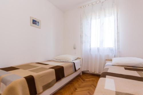 Posteľ alebo postele v izbe v ubytovaní Apartment Pavacic