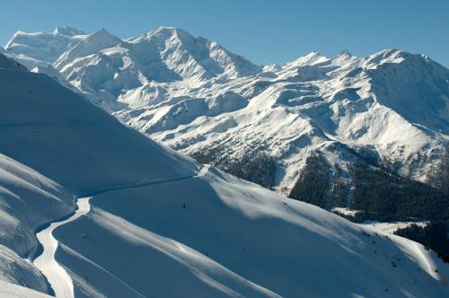 an aerial view of a snow covered mountain at La Cordée des Alpes SUP in Verbier