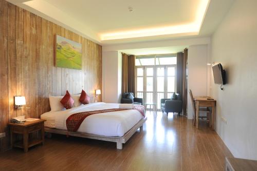 Ένα ή περισσότερα κρεβάτια σε δωμάτιο στο NanSripanna resort