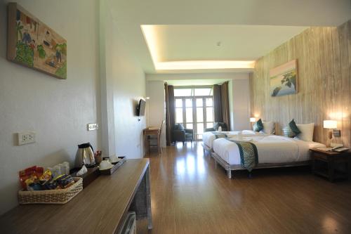 Ένα ή περισσότερα κρεβάτια σε δωμάτιο στο NanSripanna resort