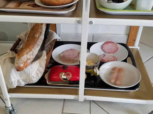 a drawer in a refrigerator filled with food at Les mésanges de l'Ill in Andolsheim