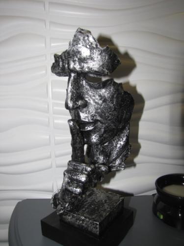 a silver statue of a woman on a table at Ashmira Guest House in Weymouth