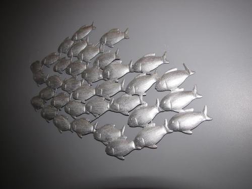 a metal cluster of fish on a wall at Ashmira Guest House in Weymouth
