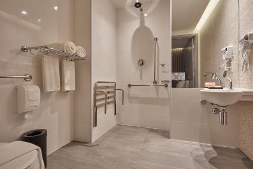 a bathroom with a sink and a shower at Flix Hotel in Maceió