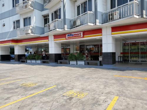 an empty parking lot in front of a building at Shell Residence Manila in Manila