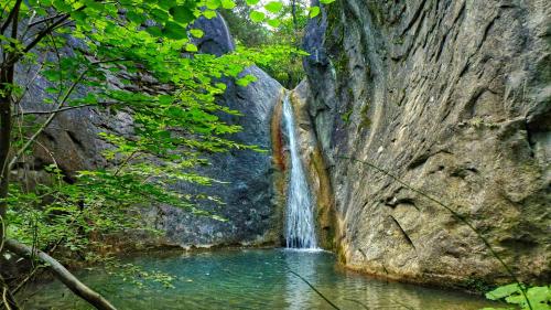 a waterfall in the middle of a pool of water at Albergo Ristorante Terme in Acquasanta Terme