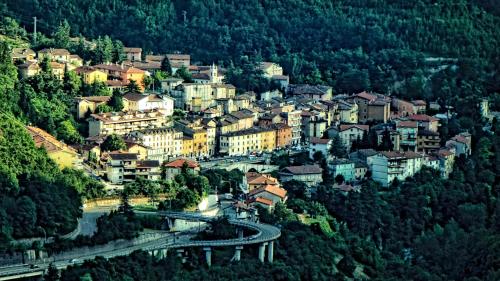a town on top of a hill with a bridge at Albergo Ristorante Terme in Acquasanta Terme