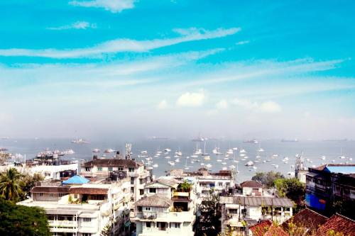 a view of a harbor with boats in the water at Hotel Godwin - Colaba in Mumbai