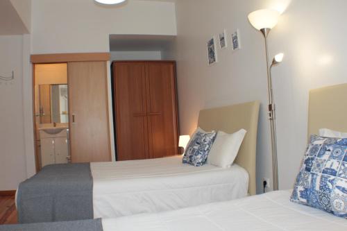 Ένα ή περισσότερα κρεβάτια σε δωμάτιο στο Dear Porto Guest House