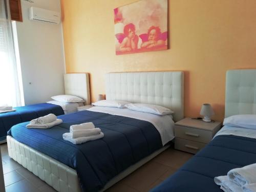Postel nebo postele na pokoji v ubytování b&b MareSalento