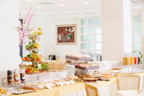 a buffet with a lot of food on a table at Baia D'Argento in Porto Santo Stefano