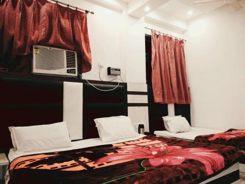 Postel nebo postele na pokoji v ubytování Hotel Marwari