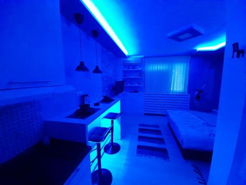 a kitchen with a blue light in a room at Victoria in Vračar (historical)