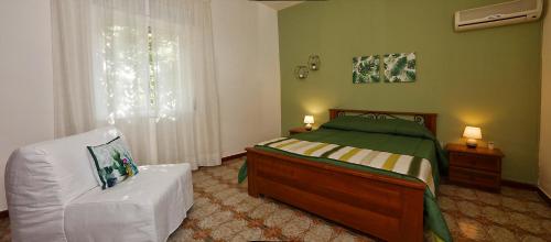 מיטה או מיטות בחדר ב-Villa Araucaria