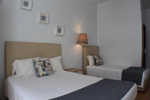 Ένα ή περισσότερα κρεβάτια σε δωμάτιο στο Dear Porto Guest House