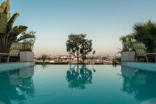 a swimming pool with a view of a city at Euphoriad in Rabat