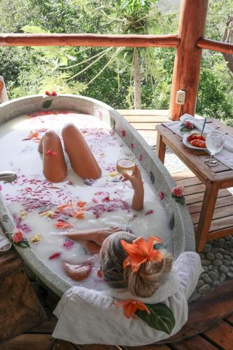 a girl laying in a pool of blood at Los Altos de Eros - Adults Only in Playa Avellana