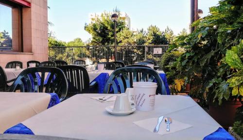 a table with a cup of coffee on top at Hotel Martini in Verona