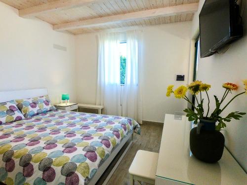 Postel nebo postele na pokoji v ubytování Villa Il Sole