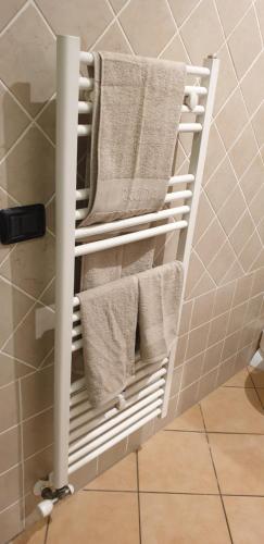 a towel rack in a bathroom with towels on it at Casa vacanza croce di città CIR 0071 in Aosta