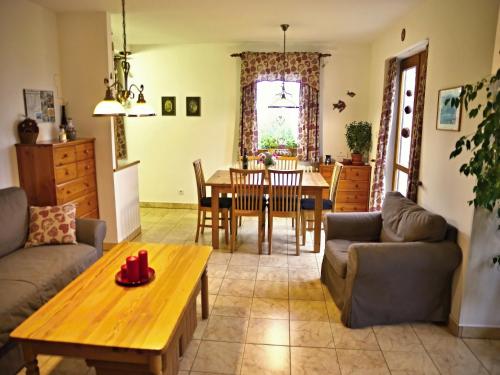 a living room with a table and a dining room at Chalupa Ivana Bozkov in Bozkov