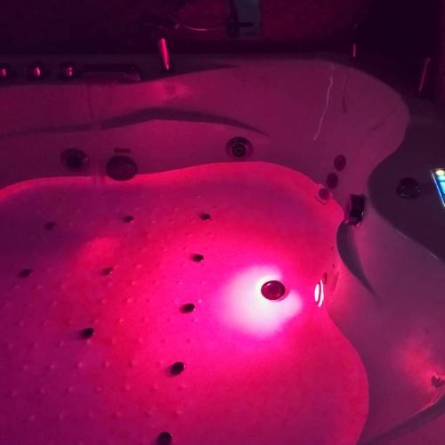 a red lighted snowman in a dark room at Le Suite del Teatro cucinino privato in Taranto