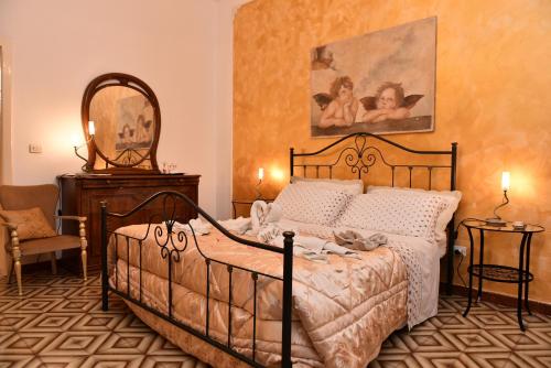 Een bed of bedden in een kamer bij Fiori e Coccole