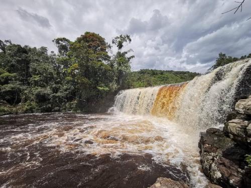 a waterfall in the middle of a river at Hotel El Ganadero in El Total