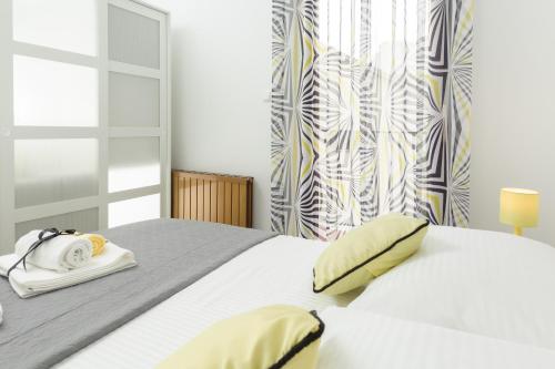 Ένα ή περισσότερα κρεβάτια σε δωμάτιο στο AMI apartments