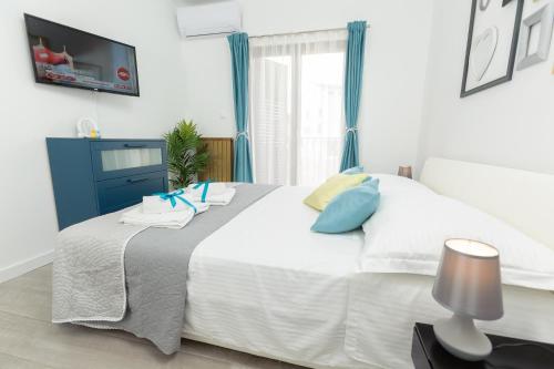 Ένα ή περισσότερα κρεβάτια σε δωμάτιο στο AMI apartments