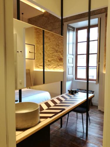 a bathroom with a sink and a bed at Old Town SXVI - Adults Only in Telde