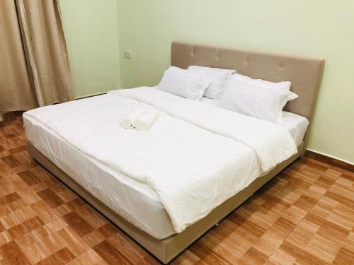 Ένα ή περισσότερα κρεβάτια σε δωμάτιο στο Atocha Homestay - Terong@Taiping