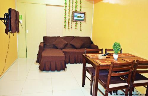 a living room with a couch and a table at Wind Residences For Rent - Luiice in Tagaytay