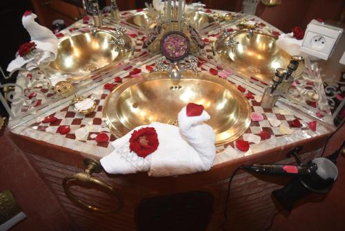 a group of three sinks in a bathroom at Riad Assalam in Marrakesh